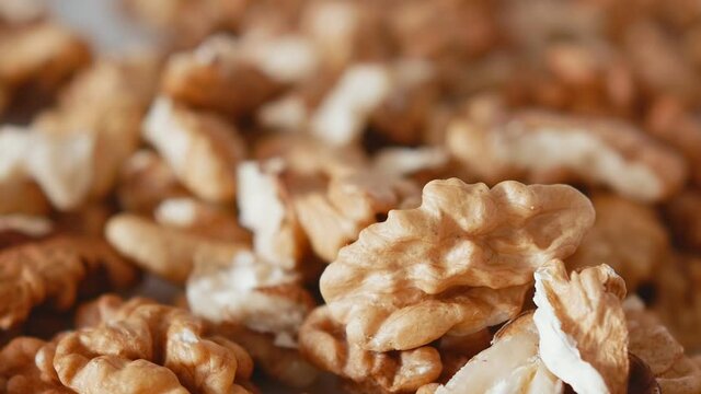 Peeled Walnuts, Nuts. Healthy Food. Peeled fresh walnut on a white plate.