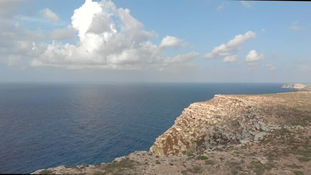 Aerial shot Lampedusa Island (Drone 4k), seagulls, isola dei conigli at sunset - concept of paradise on earth, happiness and travel to beautiful places