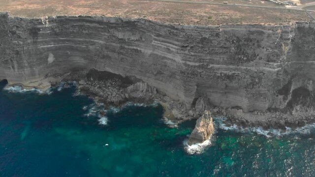 Aerial shot Lampedusa Island (Drone 4k), seagulls, isola dei conigli at sunset - concept of paradise on earth, happiness and travel to beautiful places