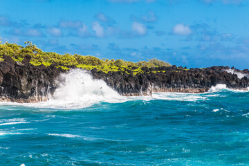 Waves Crashing Against The Black Basalt Lava Shelf at Pakulua Point, Wainapanapa State Park, Maui, Hawaii, USA