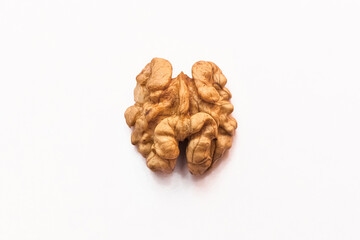 Peeled half open walnut isolated on white background, close up