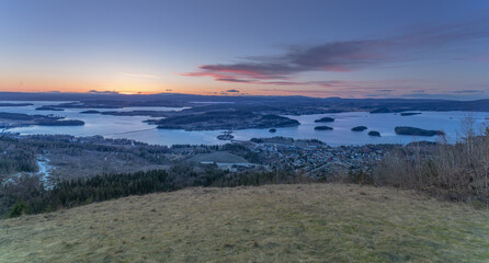 Sunset over Steinsfjorden, a branch of Lake Tyrifjorden located in Buskerud, Norway. View from Kongens Utsikt (Royal View) at Krokkleiva