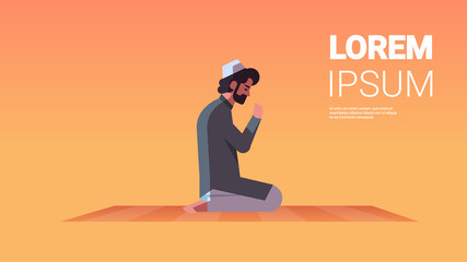 religious muslim man kneeling and praying on carpet ramadan kareem holy month religion concept flat full length horizontal copy space