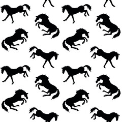 Vector seamless pattern of black hand drawn doodle sketch kicking horse isolated on white background