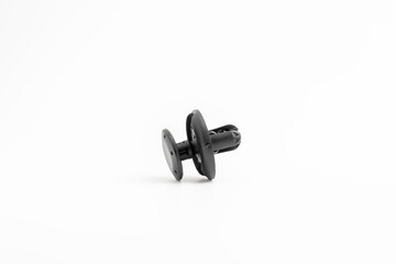 Black rivet plastic isolated on white background, used to fix workpiece to car