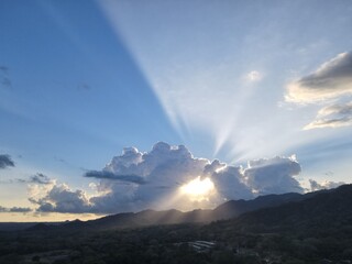 Naklejka na ściany i meble sunset in the mountains with cloud halo