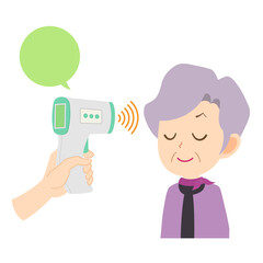 非接触体温計　目を閉じて検温を受けるシニア女性