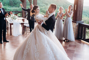 Boho style wedding party. Banquet with friends, bride and groom.