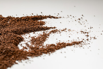 Fototapeta premium Roasted coffee ground on isolated white background