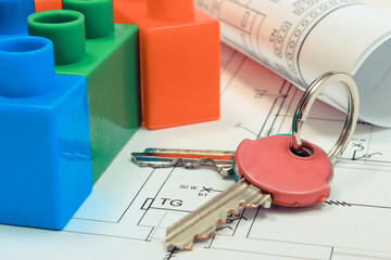 Polish currency money and building blocks on electrical construction drawing of house