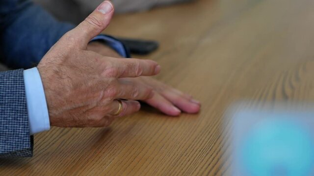 Close-up of hands of successful man in shirt and expensive jacket business concept. A lawyer or businessman negotiates with a partner or a advised the client. gesticulation