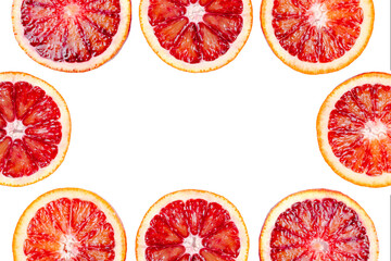Frame made of sliced bloody oranges isolated on white background. Fresh ripe red sicilian orange, citrus fruit, free space for text