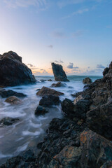 Dawn view of Pinnacle rock in high tide, Port Macquarie, Australia.