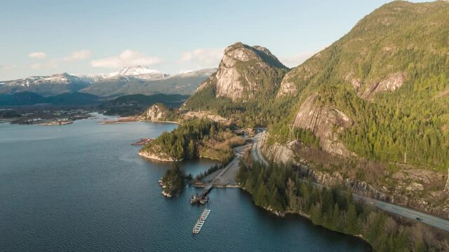 Aerial Time Lapse Hyperlapse view of Sea to Sky Highway with Chief Mountain in the background. Sunny Spring Season. Taken near Squamish, North of Vancouver, British Columbia, Canada.