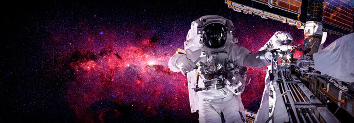Astronaut spaceman do spacewalk while working for space station in outer space . Astronaut wear...