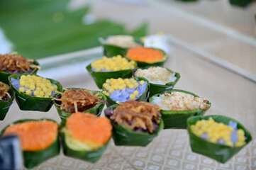 Closeup of Thai people celebrate Songkran Day with savory dishes and desserts reception in Songkran festival or Thai new year in Thailand. 