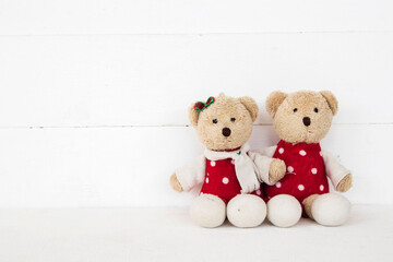 couple teddy bear arrangement flat lay postcard style on background white wooden