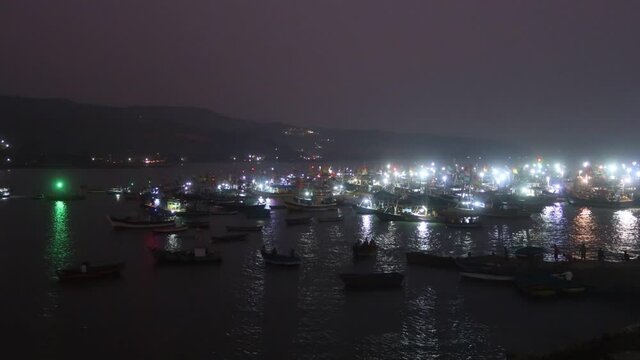 Timelapse of traditional fishing boats at Harbour during blue hour near Harnai beach, Dapoli