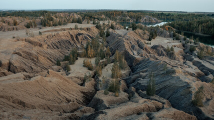 Konduki, Tula region, Romancevskie mountains, Abandoned Ushakov quarries. Turquoise water lakes and the mud erosion of the soil looks like mountains. Beautiful natural landscape