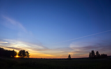 sunset over river and field