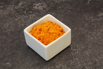 Tumeric powder in the bowl