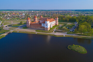 The ancient castle in a cityscape on a sunny April morning (aerial photography). Mir, Belarus