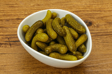 Pickled gherkin in the bowl