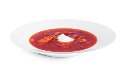 Red, hot borscht - beet soup with sour cream isolated on a white background.