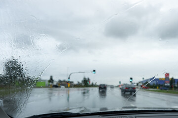 Blurred defocused image of the rain through the windscreen in Australia. Rain background