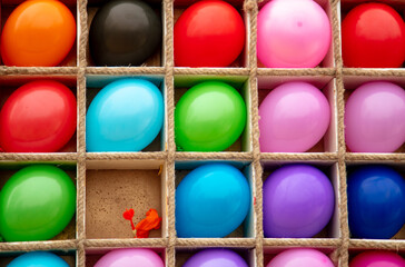 Multi-colored balls to hit with a dart.