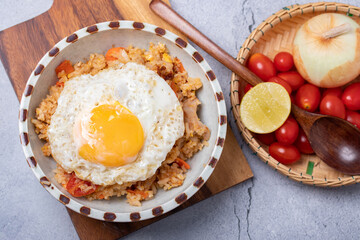 Fried rice, fried eggs and vegetables in ceramic cups