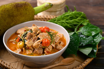 Northern Thai food (Kang Kanoon), Spicy young jackfruit soup with pork in a bowl on wooden tray