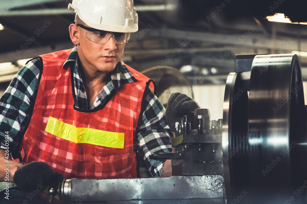 Poster smart factory worker or engineer do machine job in a manufacturing workshop . industry and engineeri