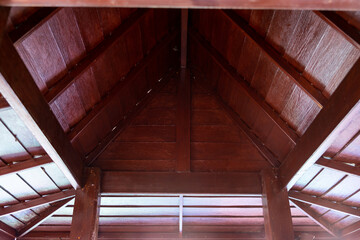 Fototapeta premium Roof top of industrial, roof structures of industrial building. Structural of roof industrial. Background and texture of steel structures and light bulb.