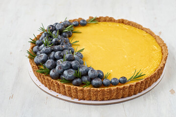 Tart with lemon curd and fresh blueberry, selective focus