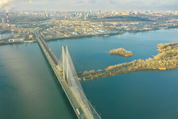 Fototapeta premium Aerial view from drone on South Bridge in Kiev, city skyline and landscape of Dnipro river, Ukraine