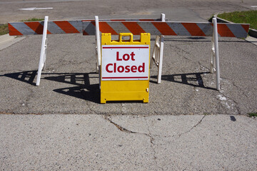 Lot Closed - temporary traffic sign and road block at a parking lot entrance © Jack