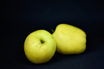Close-up green apples on black background,food photo