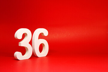 Thirty six ( 36 ) white number wooden Isolated Red Background with Copy Space - New promotion 36% Percentage  Business finance Concept                                                           