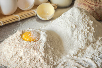 Preparation of the dough . The egg with the flour. Top view