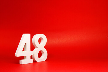 Forty Eight ( 48 ) white number wooden Isolated Red Background with Copy Space - New promotion 48% Percentage  Business finance Concept 