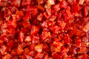 Closeup on red chopped tomato pattern texture background