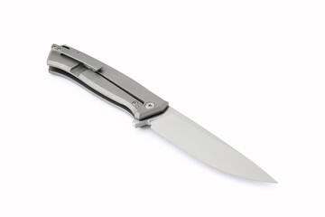 Sharp steel folding knife on a isolated white background with slight shadows. Overall design, tourism, hunting, man's passion concept.