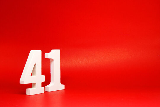 Forty One ( 41 ) white number wooden Isolated Red Background with Copy Space - New promotion 41% Percentage  Business finance Concept 