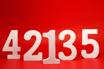 Counting numbers ( 1 2 3 4 5 ) white number wooden on Red Background with Copy Space - One Two Three Four Five 