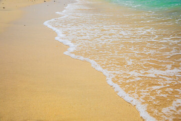 Rolling turquoise waves ashore in Dubai