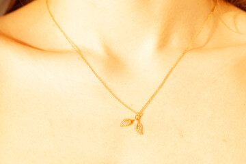 Beautiful gold jewelry on a girl close-up.