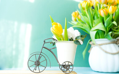 Flower composition. A small bicycle carries a bouquet of flowers 