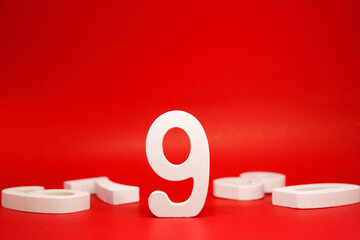 Number Nine ( 9 ) white wooden Isolated Red Background with Copy Space - New promotion 9% Percentage  Business finance Concept