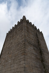 Fototapeta na wymiar Guimaraes Castle Tower over blue sky